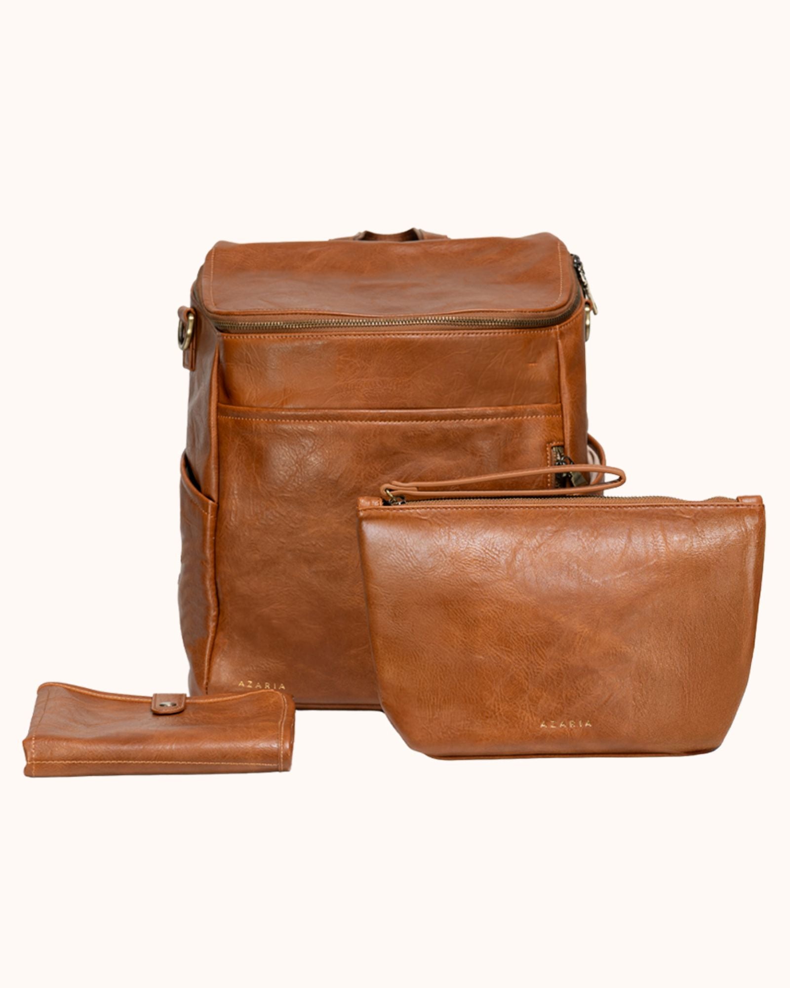 Brown leather backpack and clutch set on a white background