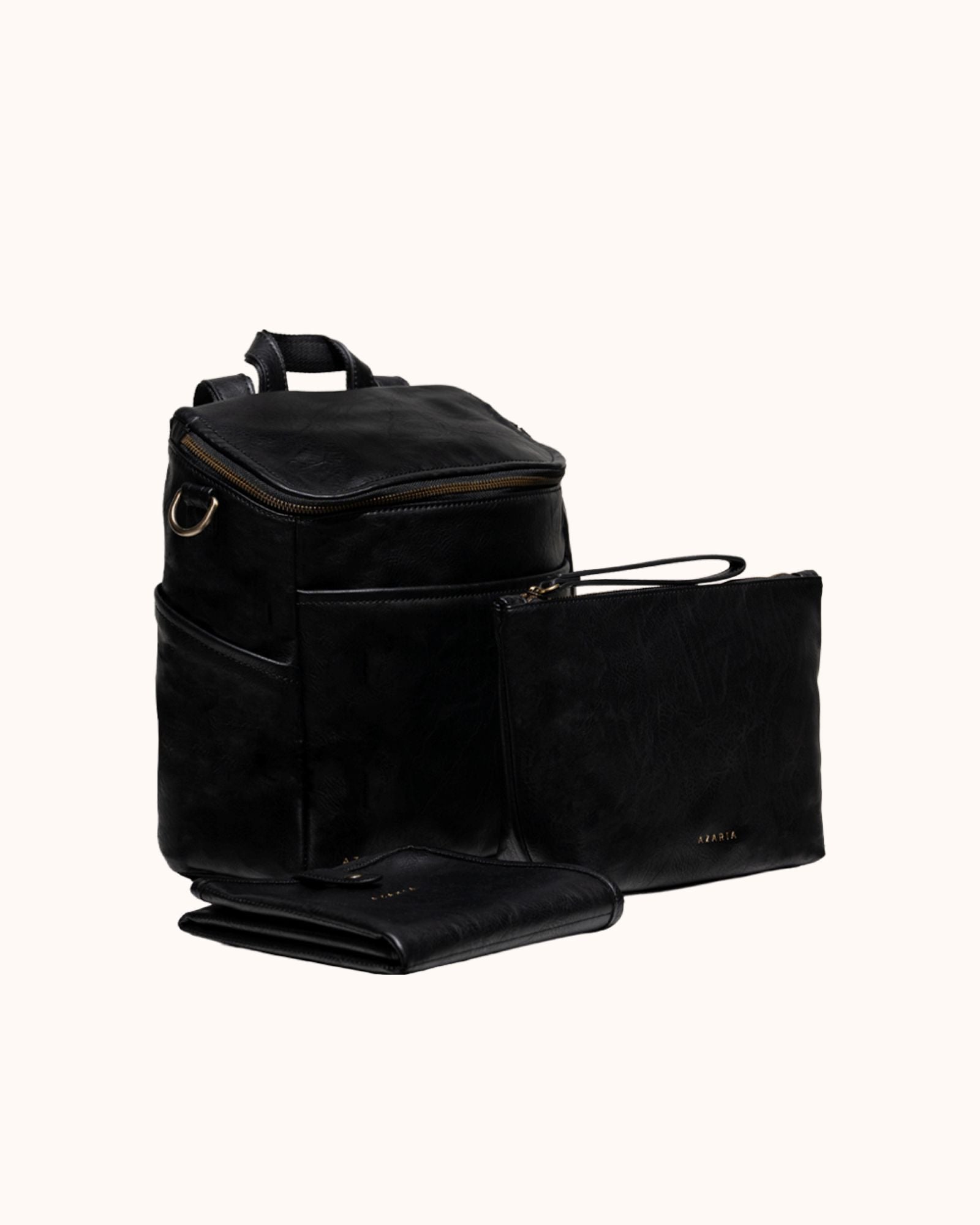 Black vegan leather backpack with a folded black leather mat on a white background