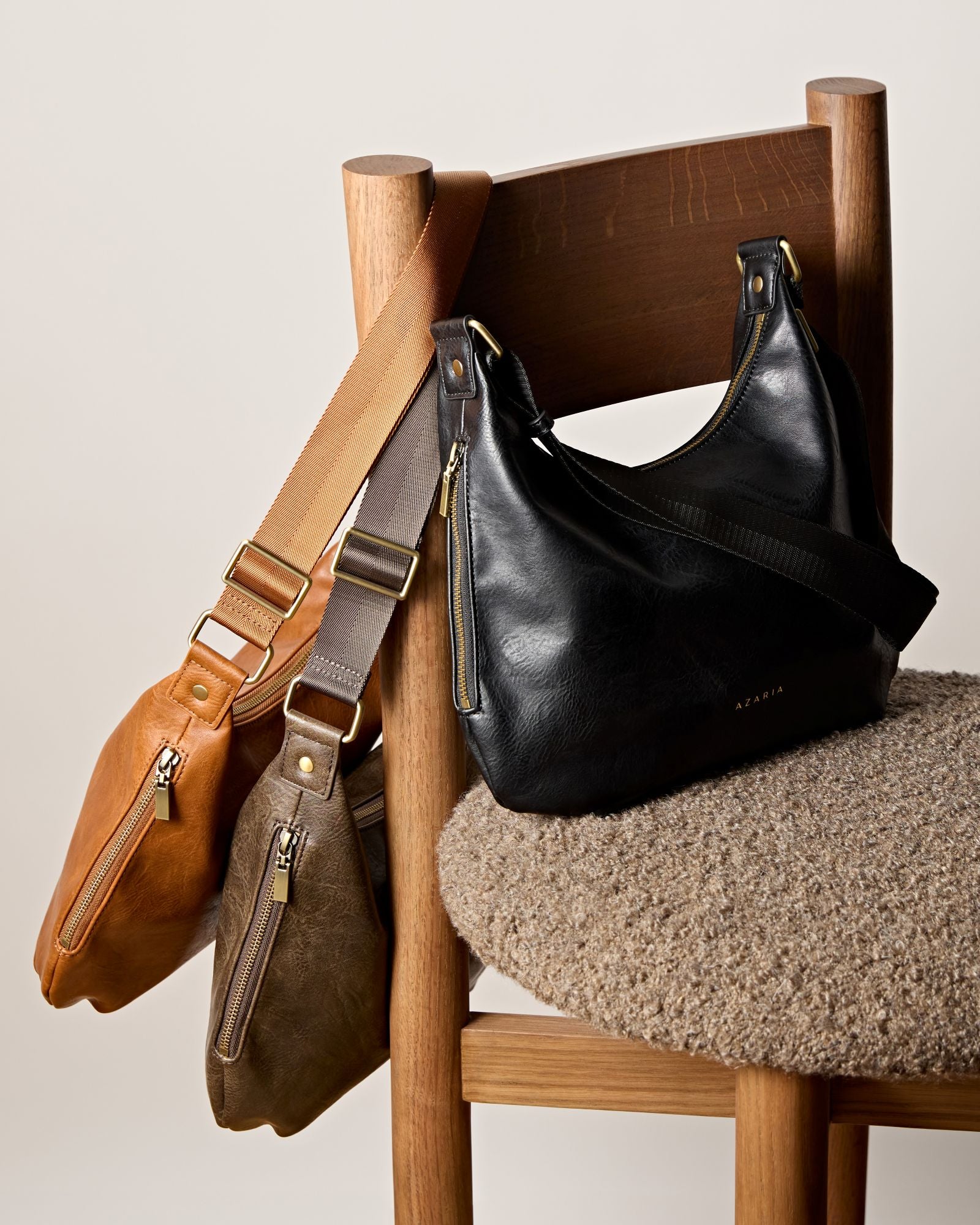 Three Soulder bags arranged on chair