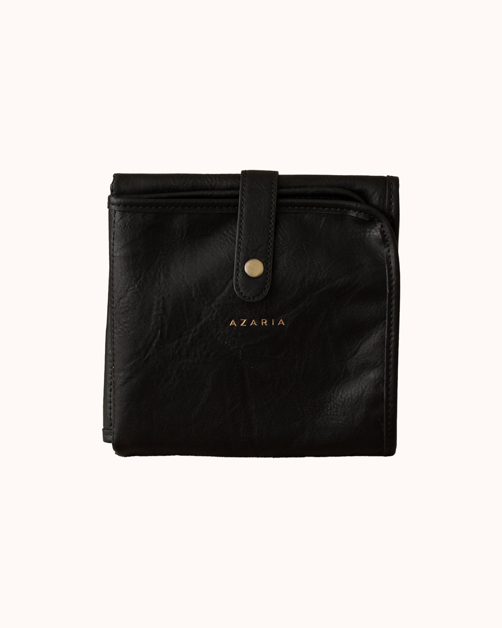 black vegan leather baby changing mat on white background