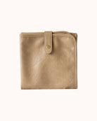 taupe vegan leather baby changing mat on white background