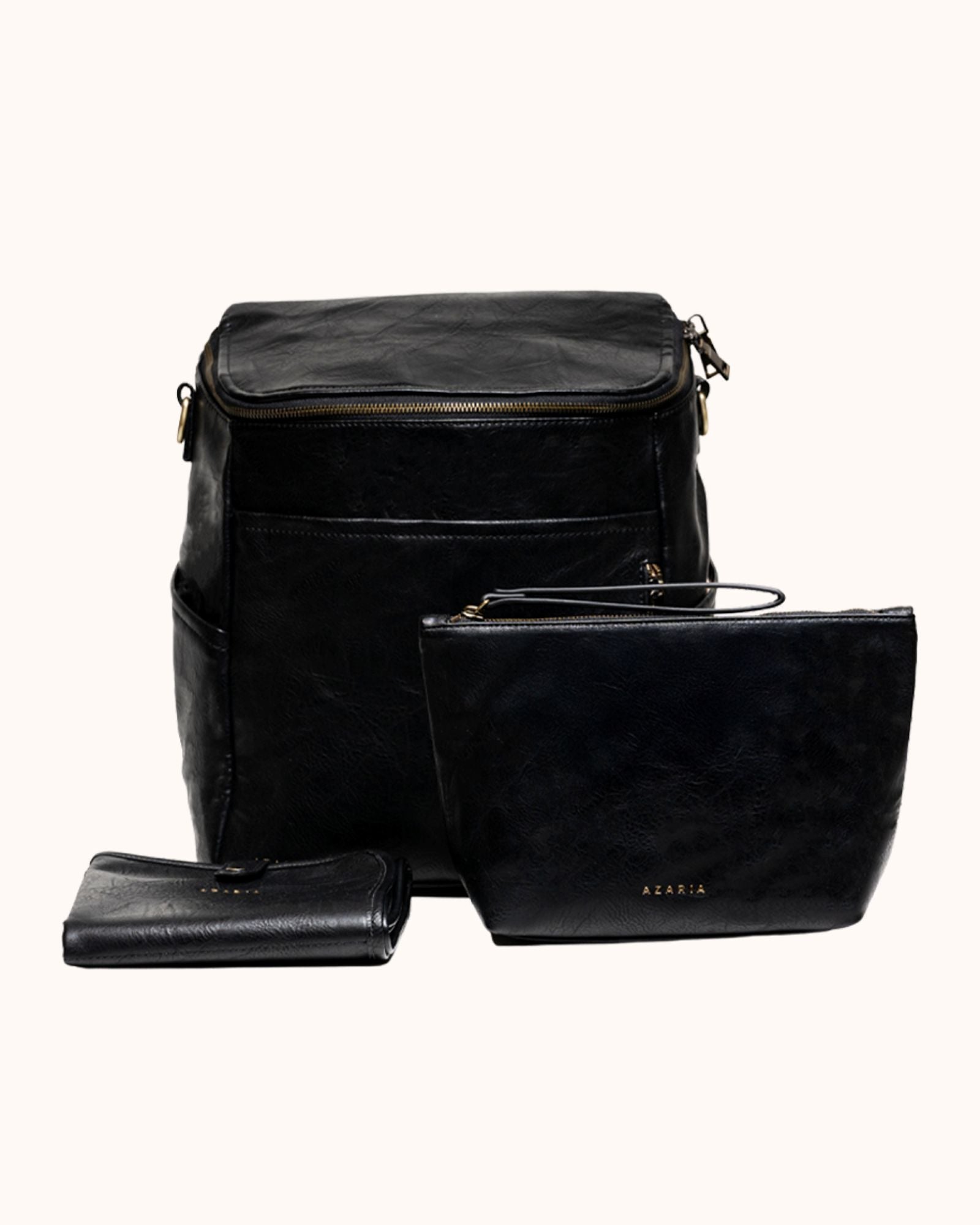 Black leather bag set with a wallet on a white background