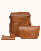 Brown leather backpack and clutch set on a white background