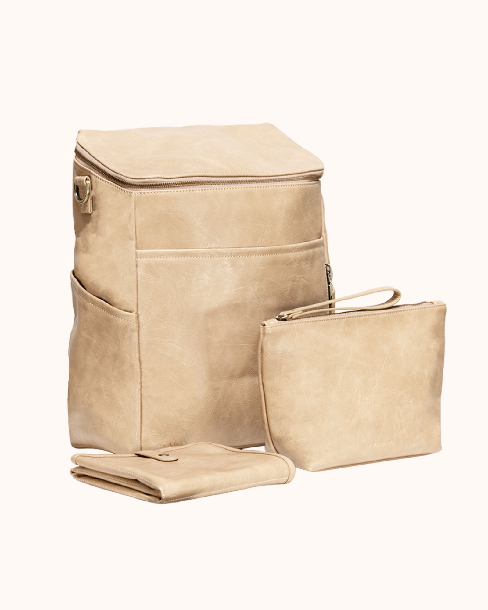 Beige diaper bag set on a white background