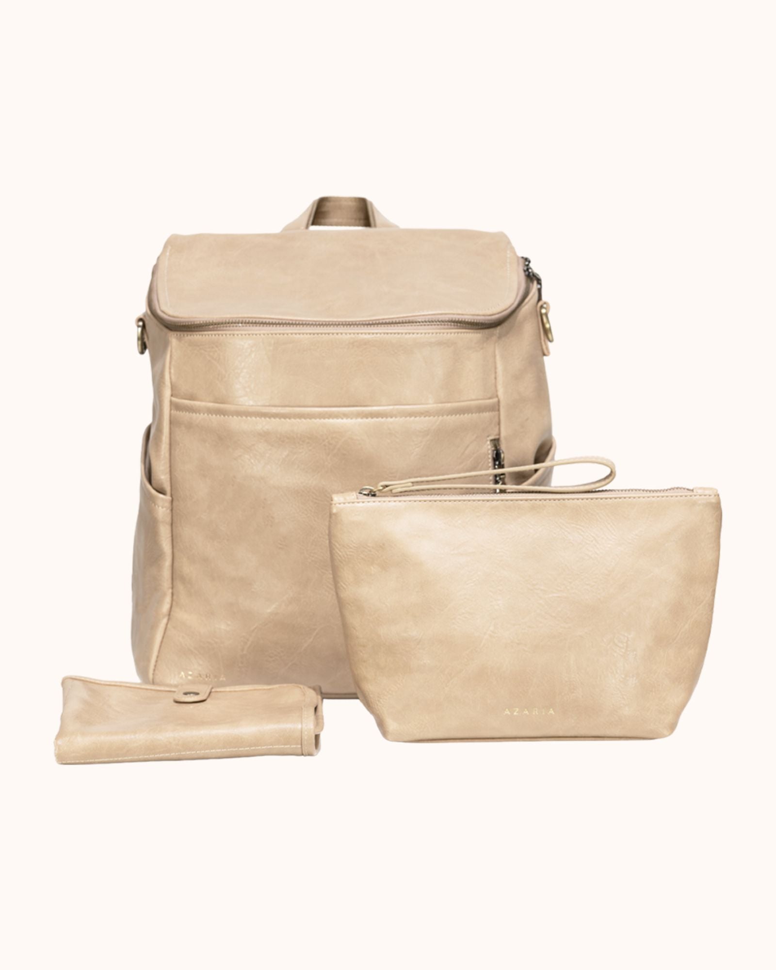 Beige leather backpack and pouch set on a white background